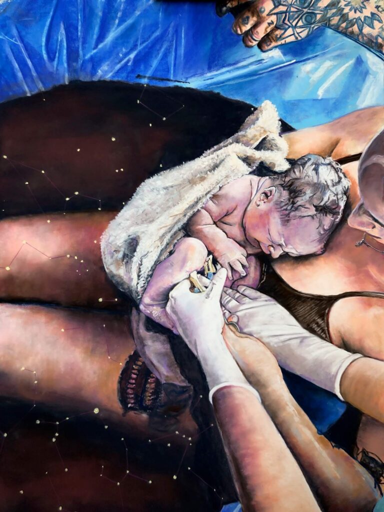 IMG_9403 Mother cradling her newborn in a pool, with midwife’s hands supporting them.