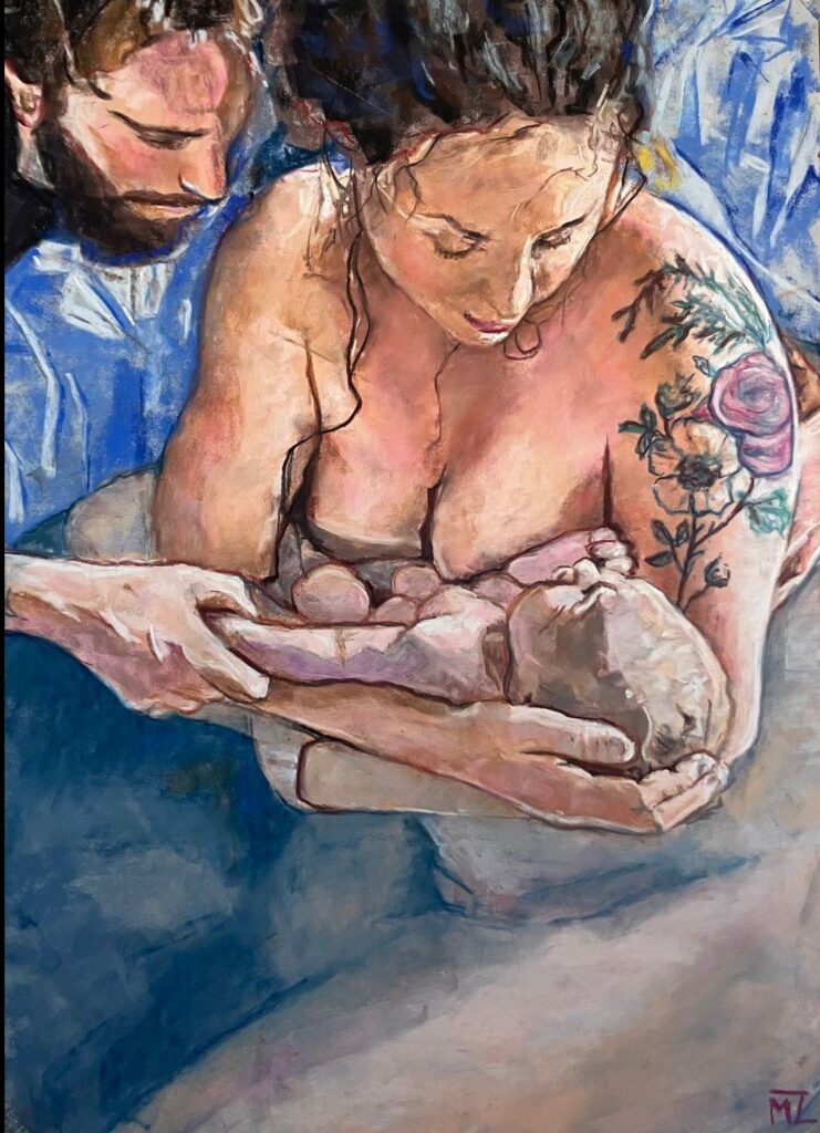 A woman is cuddling a newborn baby, and her husband is embracing her.